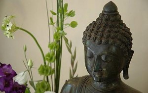 Buddha head and flowers